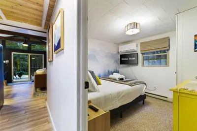 a bedroom with a bed in a room at Evergreen Escape Hot Tub Firepit Resort Pool in Thornhurst