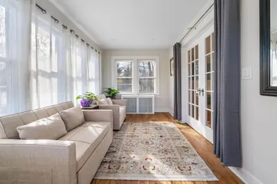 a living room with a couch and a rug at 5BR Home Minutes to NYC and FIFA 2026 Sleeps 16 in Teaneck