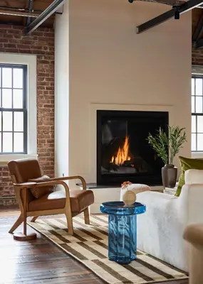 a living room with a couch and a fireplace at Eleanor Inn - Suite Amelia in Warwick