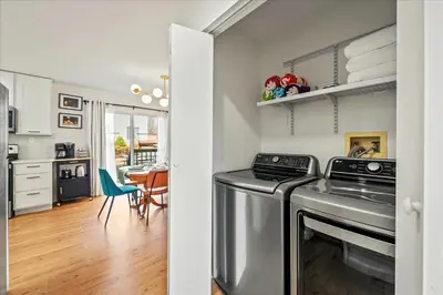 a kitchen with a washer and dryer in a room at Cozy Pocono Retreat in Tobyhanna