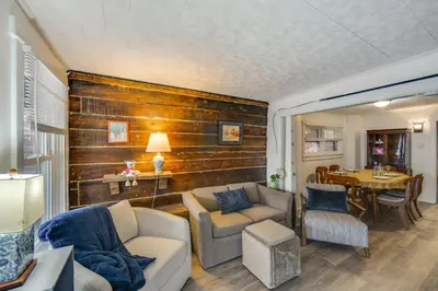 a living room with a couch and a table at WFH Space and Yard! Walkable Lancaster Row Home in Lancaster