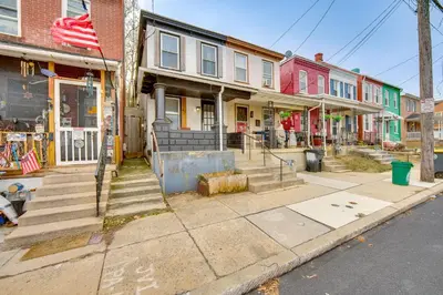 an empty street in a city with buildings at WFH Space and Yard! Walkable Lancaster Row Home in Lancaster