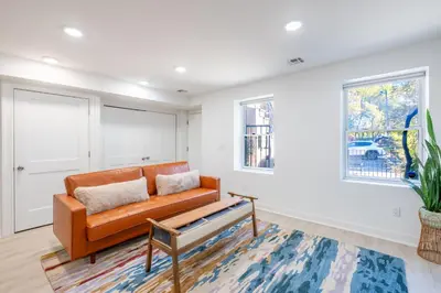 a living room with a couch and a table at 2 Beds Sleeps 4 Near NYC and MetLife FIFA 2026 in Jersey City
