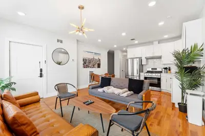 a living room with a couch and chairs at Premier 3BR-5BD-3Bath Retreat with NYC Access in Jersey City