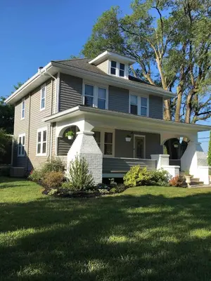 a house with a large lawn in front of it at Comfortable Craftsman Getaway in Lancaster