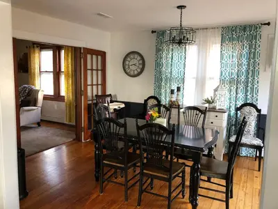 a dining room with a black table and chairs at Comfortable Craftsman Getaway in Lancaster