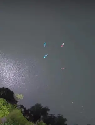 a group of boats floating in the water at Couples Lakefront Retreat in the Poconos in Saylorsburg