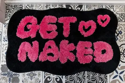 a black and pink crochet mat with the words greekmas at Couples Lakefront Retreat in the Poconos in Saylorsburg