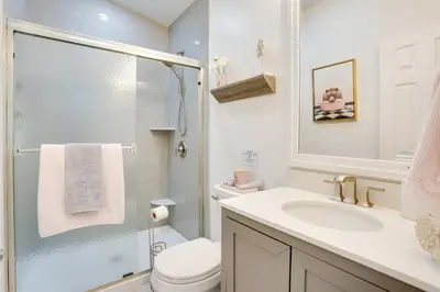 a bathroom with a toilet and a sink and a shower at Hike and Explore! Nature-Centric Hudson Valley Home in Napanoch