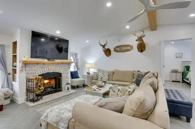 a living room with a couch and a fireplace at Hike and Explore! Nature-Centric Hudson Valley Home in Napanoch