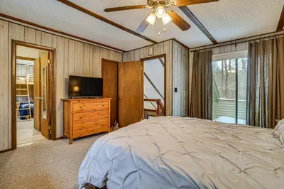 a bedroom with a bed and a flat screen tv at Poconos Retreat in The Hideout Lake Community! in Lake Ariel