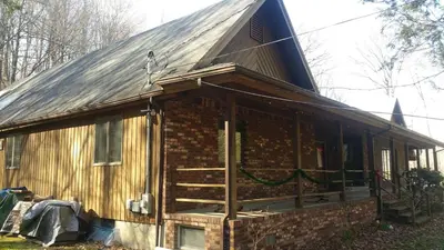 a small house with a gambrel roof at Eagles Nest Mansion in Montgomery