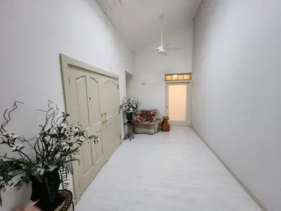 a hallway with a door and flowers in a room at Eagles Nest Mansion in Montgomery