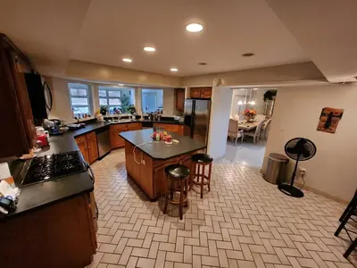 a kitchen with a counter and a stove top oven at Eagles Nest Mansion in Montgomery