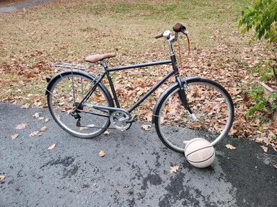 a bike parked on the street with a basketball at Eagles Nest Mansion in Montgomery