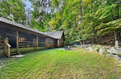 a house with a yard in front of it at Eagles Nest Mansion in Montgomery