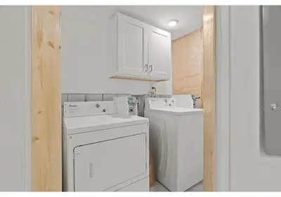 a white laundry room with a washer and dryer at Fairmount Park GSN Soil 2 in Philadelphia
