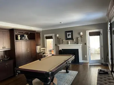 a room with a pool table and a fireplace at Luxury Private Estate, 5BR 6BA, close to MetLife with ample parking in Green Village