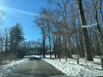 an empty road with snow on the side of it at Luxury Private Estate, 5BR 6BA, close to MetLife with ample parking in Green Village
