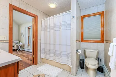 a bathroom with a toilet and a shower at Blissful Mountain Getaway