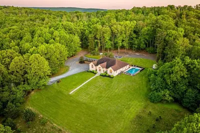 an aerial view of a large estate with a house at Blissful Mountain Getaway