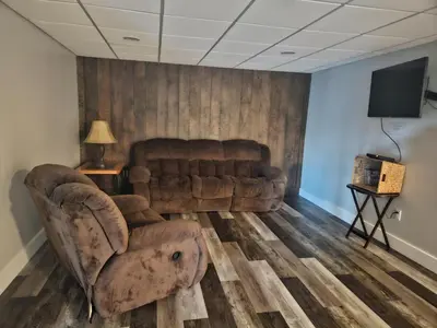 a living room with a couch and a television at Fernwood Vista in Strasburg