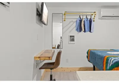 a bedroom with a bed and a desk and a chair at Temple Town GSN Soil 3 in Philadelphia