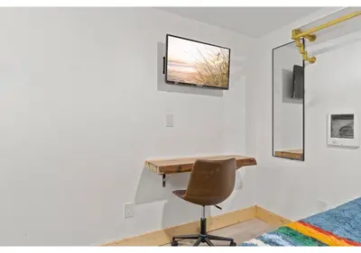 a desk in a room with a chair and a window at Temple Town GSN Soil 3 in Philadelphia