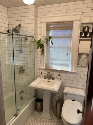 a bathroom with a sink and a toilet and a shower at Stylish Mission-Style Home on Park in Jersey City, NJ in Jersey City