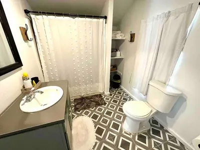 a bathroom with a white toilet and a sink at Boyertown Bungalow Near the Manatawny Creek in Boyertown