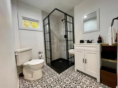 a bathroom with a toilet and a shower at Fir Lane Lodge Near the Manatawny Creek in Boyertown