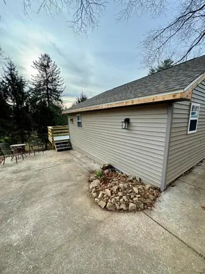 a building with a pile of rocks next to it at Manatawny Creek Cottage in Boyertown
