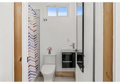 a bathroom with a white toilet and a sink at Center City Philadelphia GSN Bloom 1 in Philadelphia