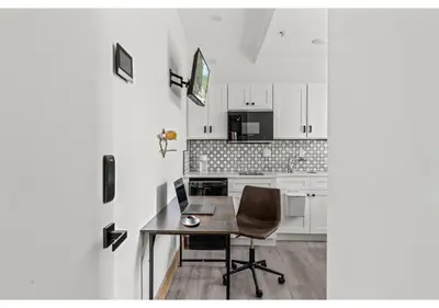 a kitchen with a table and a chair in a room at Center City Philadelphia GSN Bloom 1 in Philadelphia