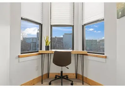 an office with windows with a desk and a chair at Temple District GSN Bloom3 in Philadelphia