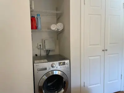 a washer and dryer in a small room at VAN VORST HOUSE Prime Location Minutes to NYC in Jersey City