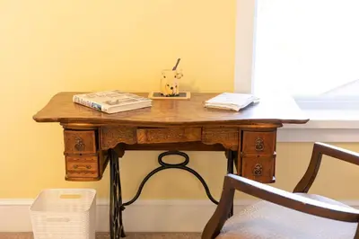 a wooden table with a book on top of it at Private 2-Bedroom Second-Floor Residence, Bala Cynwyd in Bala-Cynwyd