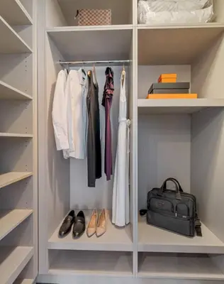 a walk in closet with shoes and a bag at Alluring and Spacious 1 Bed 1 Bath Apt in New York