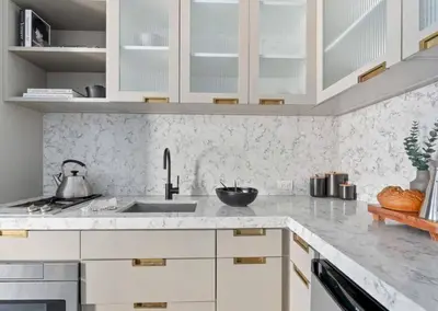 a kitchen with white cabinets and a sink at Alluring and Spacious 1 Bed 1 Bath Apt in New York