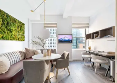 a living room with a couch and a table at Alluring and Spacious 1 Bed 1 Bath Apt in New York