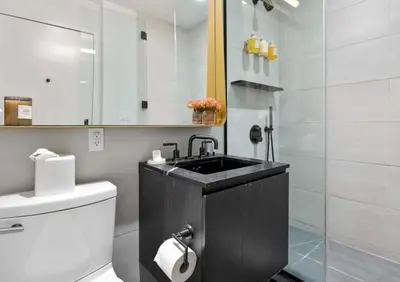 a bathroom with a sink and a toilet at Alluring and Spacious 1 Bed 1 Bath Apt in New York