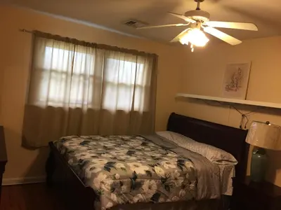 a bedroom with a bed and a ceiling fan at Fully furnished unit for rent in Wilmington