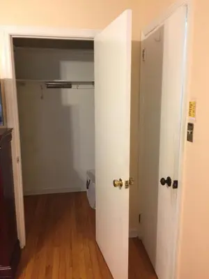 an empty room with a door and a closet at Fully furnished unit for rent in Wilmington