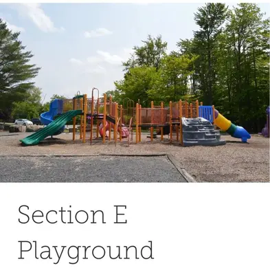 a playground with a slide and play equipment at Cozy Cabin in Tobyhanna