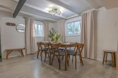 a dining room with a table and chairs at Summit Home - The Ultimate Summit of Style for 12 in Tobyhanna