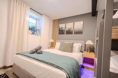 a bedroom with a large bed in a room at Summit Home - The Ultimate Summit of Style for 12 in Tobyhanna