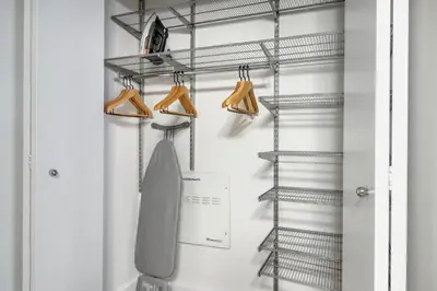 a closet with a neck tie and hangers at Chelsea 1br w doorman wd nr West Village NYC-1385 in New York