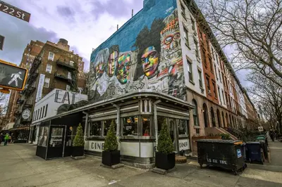 a building with a mural on the side of it at Chelsea 1br w doorman wd nr West Village NYC-1385 in New York