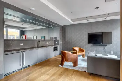 a kitchen with a couch and a table and chairs at Blueground Gramercy Park rooftop nr Flatiron NYC-2203 in New York