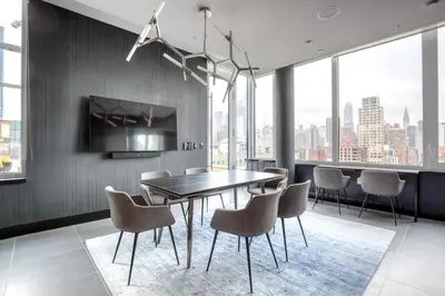 a dining room with a table and chairs at Blueground Gramercy Park rooftop nr Flatiron NYC-2203 in New York